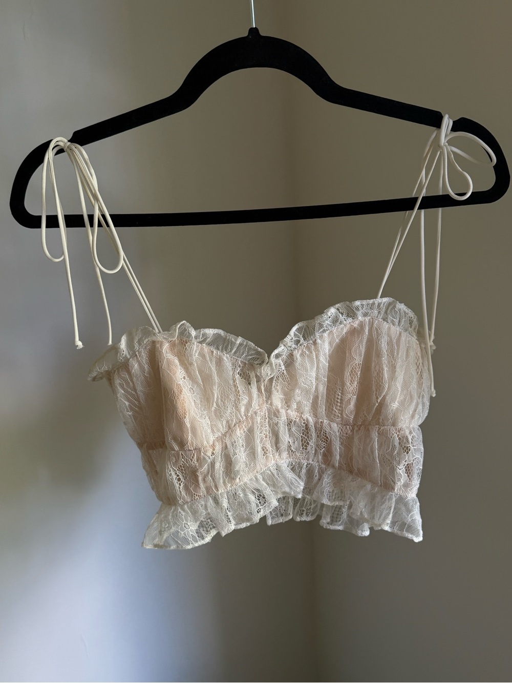 ForLove&Lemons Jules crop top featuring ruffled trims and sheer lace fabric.